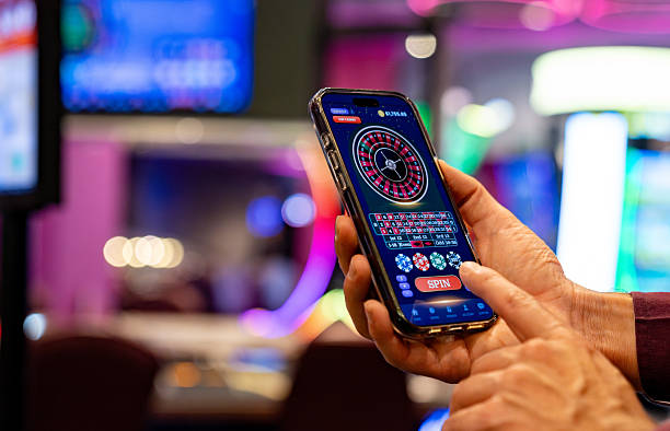Mobile phone showing vivatogel SEA Games interface with live table and sportsbook markets